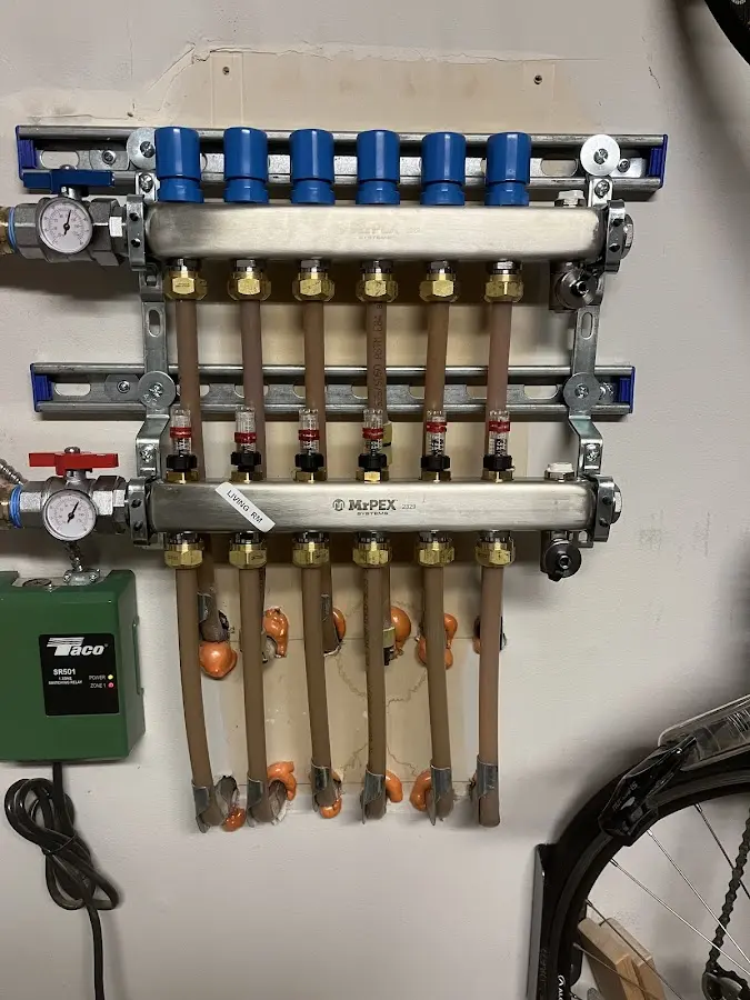 Plumber performing Water Heater Repair at a residential property in Chatfield